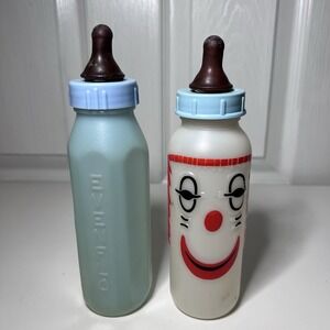 2-Vtg 1970s Baby Bottles 8 oz Curity "Cuddly Clown Nurser" & Blue
